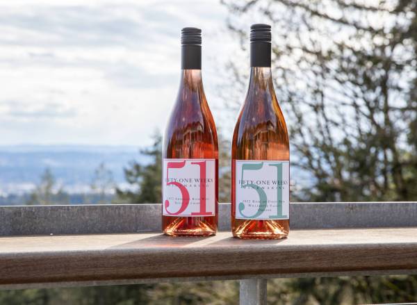 51Weeks Winemaking bottles on a banister